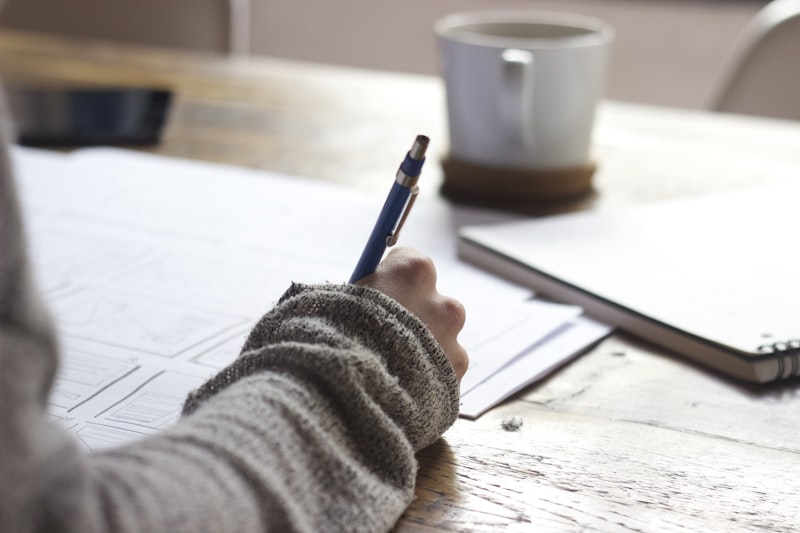Student writing notes